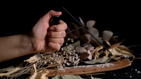 Burning incense stick on black background Stock Footage 128629764