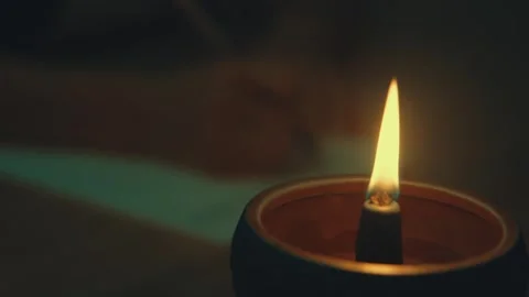 Burning Incense Stick in Clay Holder Creating Warm Soft Glow 動画素材 337424705