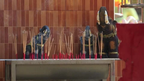 Burning incense sticks in front of deities Video stock 266784423
