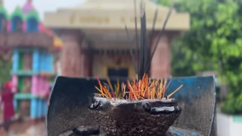 Burning Incense Sticks with Hindu Temple in Soft Focus Background During Prayer Video stock 341717536
