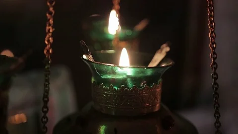 Burning lamps  in the temple Stock Footage 71269916