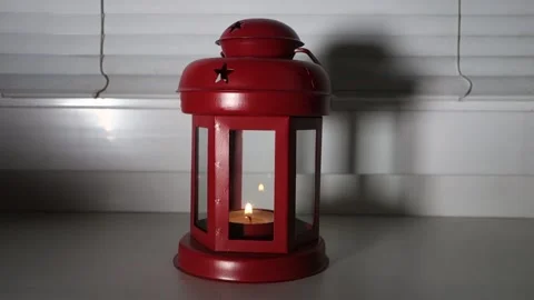 Burning lantern on a window sill during the Christmas holidays Stock Footage 167509588