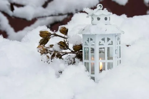 Burning lantern winter day Stock Photos