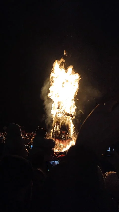 Burning large straw effigy Winter square street Maslenitsa holiday Vertical Stock Footage 305135764