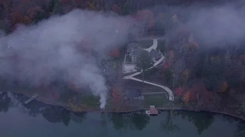 Burning Leaves on the Lake Stock Footage 82624471