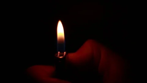 Burning lighter in the darkness Stock Footage 81857639
