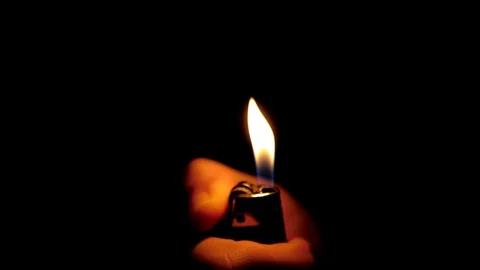 Burning lighter in hand. Stock Footage 117533205