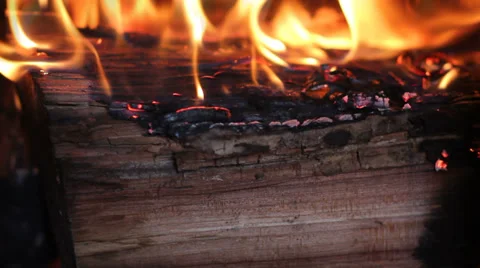 Burning log in a fireplace Stock Footage 33195758
