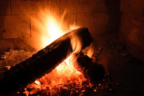 Burning Log in Fireplace Stock Photos