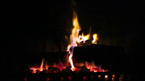 Burning logs and glowing embers in fireplace Stock Footage 329974677