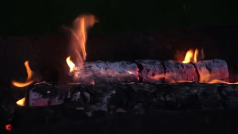 Burning logs background. Flames of fire in fireplace at night. Stock Footage 336365502