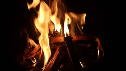 Burning logs in chimenea Stock Footage