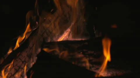 Burning logs in fire pit outside at night time. Slow Motion. Stock Footage 50504791