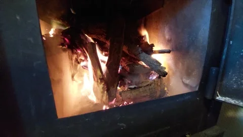 Burning logs in a fireplace with bright flames and glowing embers Stock Footage 334186166