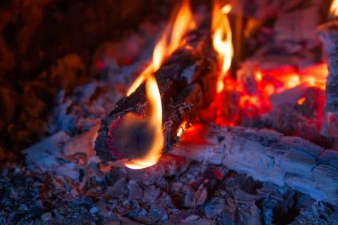 Burning logs in the fireplace close up Stock Photos