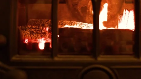 Burning Logs Inside a Traditional Cast Iron Wood Stove Stock-Footage 341454859