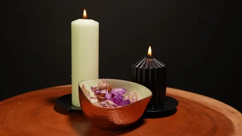 Burning magic candles with gold bowl of dry flower petals. Ritual scene and.. Stock Footage 307731343