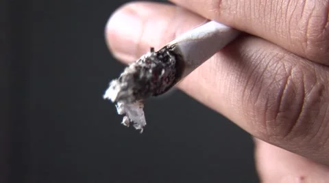 Burning marijuana joint in man's hand Stock Footage 50605467