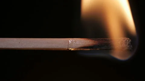 Burning match on black background in macro Stock Footage 106032372
