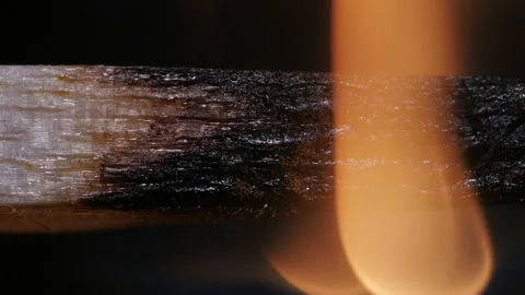 Burning match on black background in macro Stock Footage 106033010