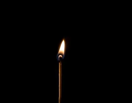 Burning match, on a black background Stock Photos