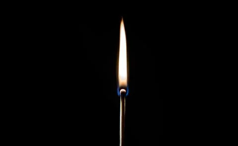 Burning match, on a black background Stock Photos