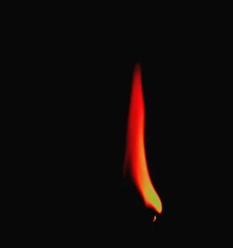 Burning match on black background 库存照片