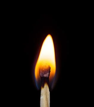 A burning match as the concept of a continuing process Stock Photos