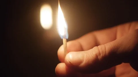 Burning match in hand, flash and fire Stock Footage 124288396