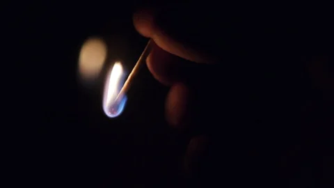 Burning match in hand, flash and fire Stock Footage 124288403