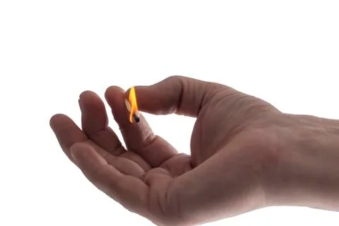 Burning match in the hand. Stock Photos