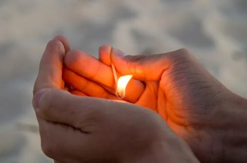Burning match in hands. Stock Photos