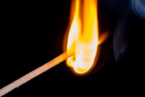 Burning match isolated on black background Foto stock