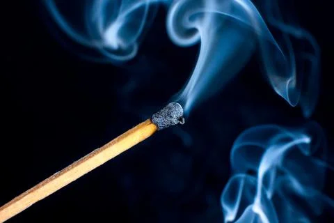 Burning match isolated on black background Foto stock