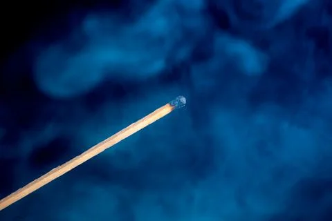 Burning match isolated on black background Stock Photos