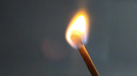 Burning match on a light background. Foto stock