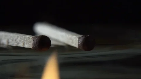 Burning matches on black background Stock Footage 71754704