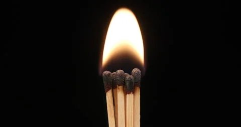 Burning matches on a black background Stock Footage 162589321