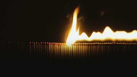 Burning matches in slowmotion on black background Stock Footage 86232394