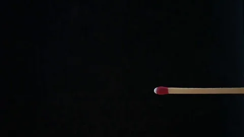 Burning matchstick on black background Stock Footage 77377145
