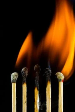 Burning matchstick Stock Photos