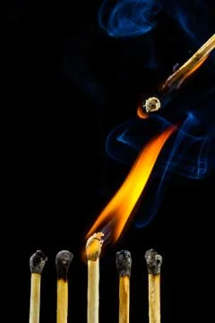 Burning matchstick Stock Photos