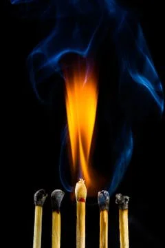 Burning matchstick Stock Photos
