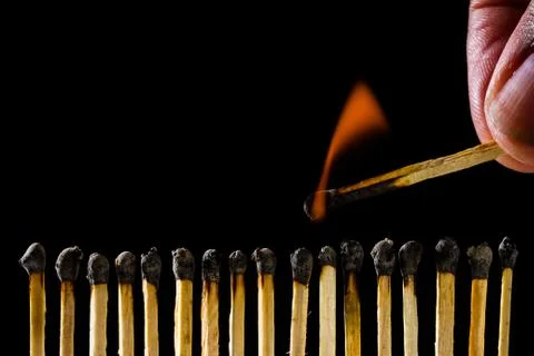 Burning matchstick Stock Photos