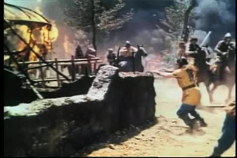 Burning medieval soldier falling to ground during invasion Stock-Footage 11348920