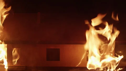 Burning model of a house on fire. Building engulfed by flames Stock Footage 293069945