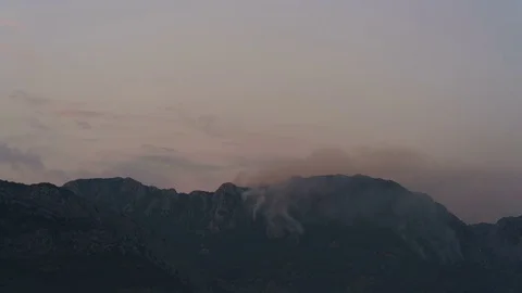 Burning mountain at dusk Stock Footage 79048286