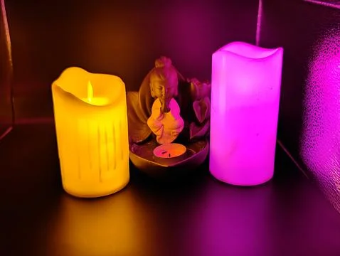 Burning multi-colored candles Foto stock