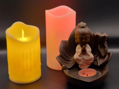 Burning multi-colored candles Stock Photos