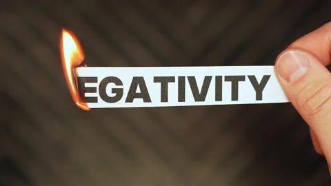 Burning “NEGATIVITY” concept symbolizing positive mindset, emotional reset Stock Footage 333651268